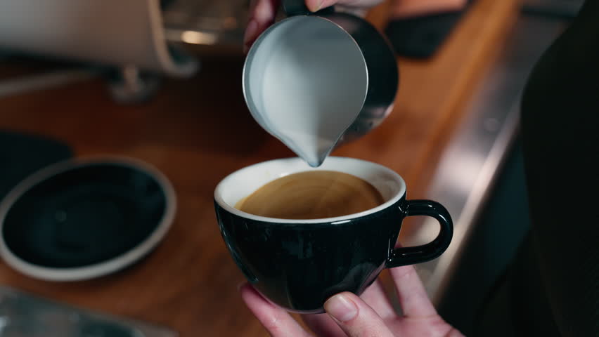 Unrecognizable Caucasian barista male waiter employee hands close up making coffee drink milk latte for client restaurant professional man worker guy preparing tasty beverage order in cafeteria cafe