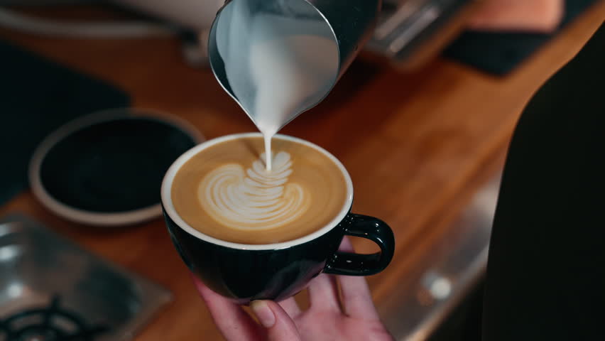 Unrecognizable Caucasian barista male waiter employee hands close up making coffee drink milk latte for client restaurant professional man worker guy preparing tasty beverage order in cafeteria cafe