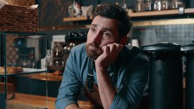Tired bored Caucasian male entrepreneur cafeteria worker man feel exhausted sad in coffee shop barista small business owner problem no clients restaurant crisis upset waiter guy waiting for customers - Powered by Shutterstock - Get 15% off with code: PIKWIZARD15