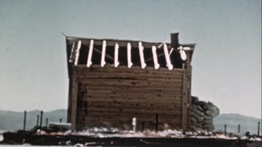Burning woods near a house construction