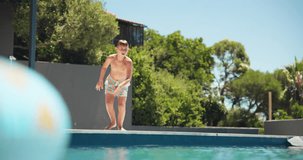 Holiday, child running and jump in swimming pool for vacation, relax or travel to play at resort outdoor. Boy, kid and swimmer dive in water for summer tourism, learning or splash for energy at hotel - Powered by Shutterstock - Get 15% off with code: PIKWIZARD15