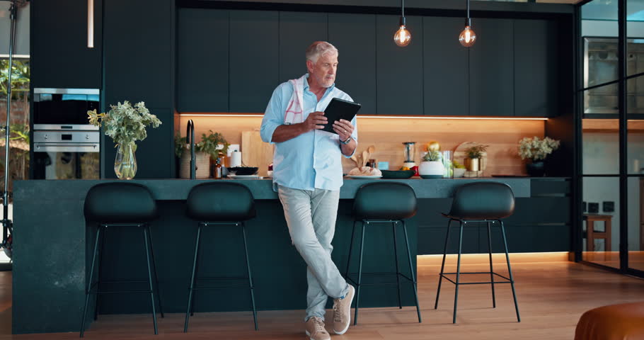 Senior man, home and tablet for recipe, food website and online tutorial for healthy meal guide. Elderly person, retirement and thinking on nutrition in kitchen, ingredients plan and instructions