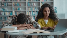 Tired students African American man Latino Arabian woman library project team exhausted sleepy classmates university learning study preparing difficult exam laptop textbook book high school education - Powered by Shutterstock - Get 15% off with code: PIKWIZARD15