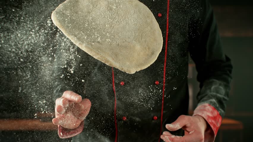 Super Slow Motion of Chef Processing Pizza Yeast Dough. Filmed on High Speed Cinema Camera, 1000 fps. Closeup of Pizza Dough Preparation.