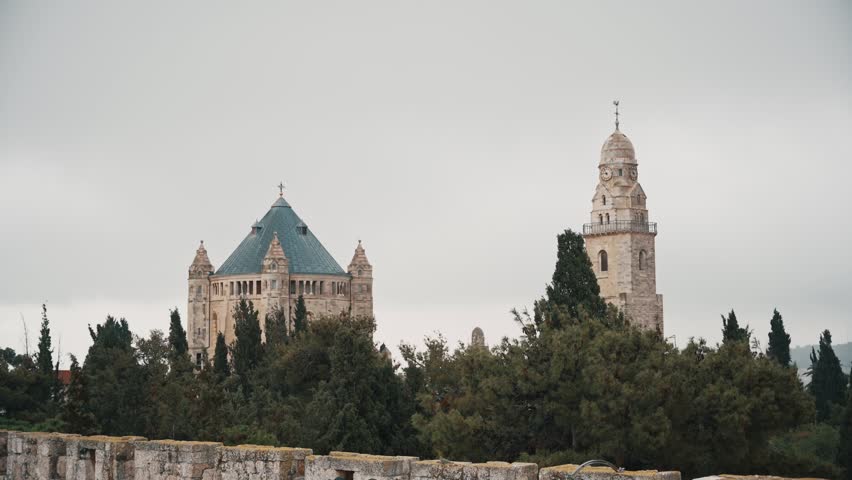 The Dormition Abbey dome and tower on Mount Zion
Hill in Israel with gray sky