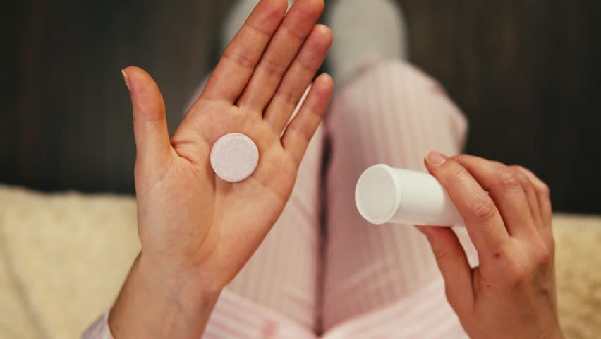 Pills and vitamins macro, Close up view of womans hands holding plenty of different drugs. Painkillers and antibiotics. Healthcare and medicine concept