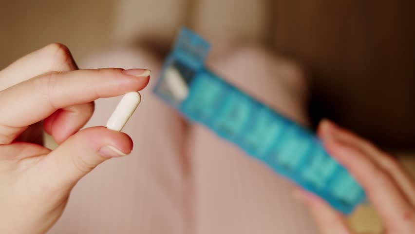 Pills and vitamins macro, Close up view of womans hands holding plenty of different drugs. Painkillers and antibiotics. Healthcare and medicine concept