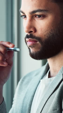 Man, pen and thinking in office for business, career growth and confident with ambition. Male investor, face and vision at window for urban development, decision and choice for investment opportunity