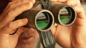 Close Up Of A Man Using Binoculars - Powered by Shutterstock - Get 15% off with code: PIKWIZARD15