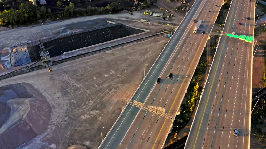 Aerial view of Cleveland, Ohio skyline and I90 interstate highway at sunset with slow camera uptilt. Cleveland is a major city in the U.S. state of Ohio and the county seat of Cuyahoga County.