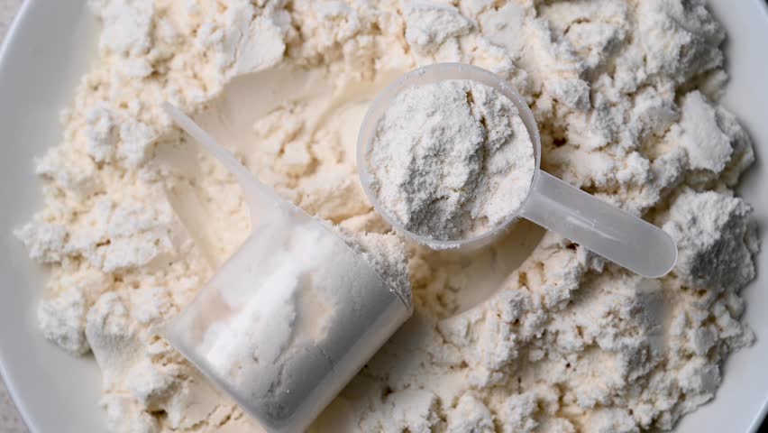 Protein whey powder with scoops. Food supplement, bodybuilding, fitness and gym lifestyle. 