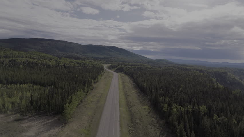 The Alaska Highway cutting through Yukon’s pristine terrain