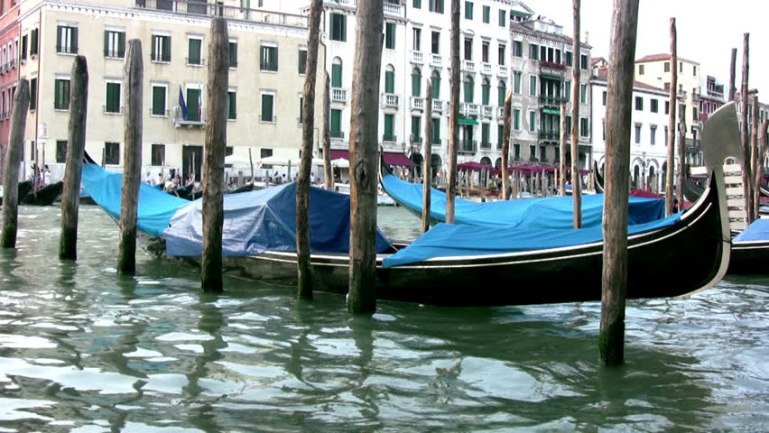 Venice. Canal. On the waves rocking the gondola under the covers. The gondola is