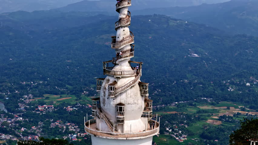 Iconic tower of Ambuluwawa in Sri Lanka, close up aerial orbit view