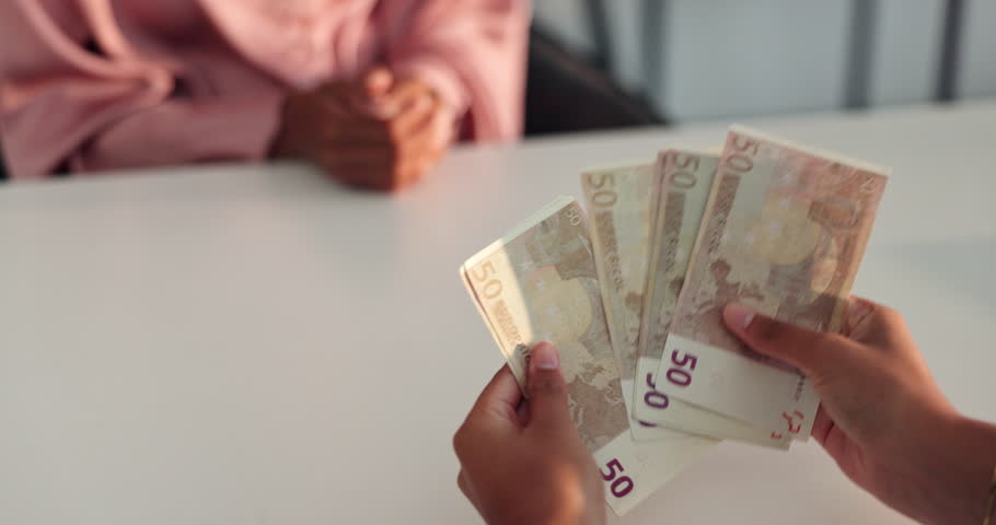 Person, hands and counting with money for loan, borrow or cash salary at office desk. Closeup, employer or accountant with euro bills or payment for profit, investment or company raise at workplace