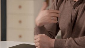 Close-up of mature male hands using sign language for communication while hearing impaired man talking with friend indoors. - Powered by Shutterstock - Get 15% off with code: PIKWIZARD15