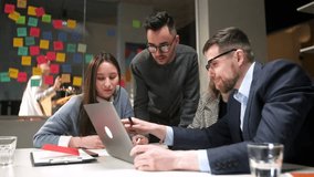 Colleagues And Clients Talking Strategy With Laptop And Tablet. In Creative Office Productive Coworkers Standing At The Table For Company Meeting. Teamwork And Scial Concepts - Powered by Shutterstock - Get 15% off with code: PIKWIZARD15