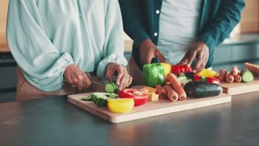 Kitchen, couple and hands with vegetables for cooking, nutrition and bonding together at home. House, man and woman with food for meal prep, healthy diet and support in marriage for dinner by closeup - Powered by Shutterstock - Get 15% off with code: PIKWIZARD15