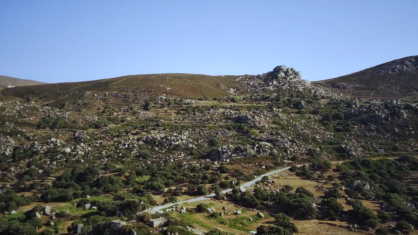 A drone of the Volax Plateau on a sunny day in Falatados, Tinos Island in the Cyclades, Greece