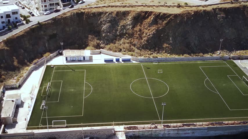 A drone footage of Tinos Municipal Stadium in Tinos island on a sunny day, Greece