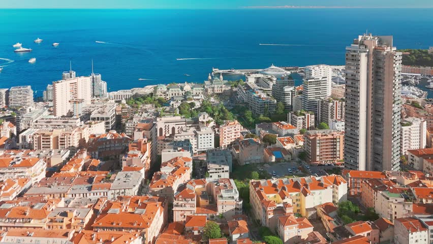 Aerial view of the Monte-Carlo casino in Monaco. Luxurious supercars in front of the hotel. City center of the Principality of Monaco. Famous casino and luxury buildings in Monte Carlo, Monaco