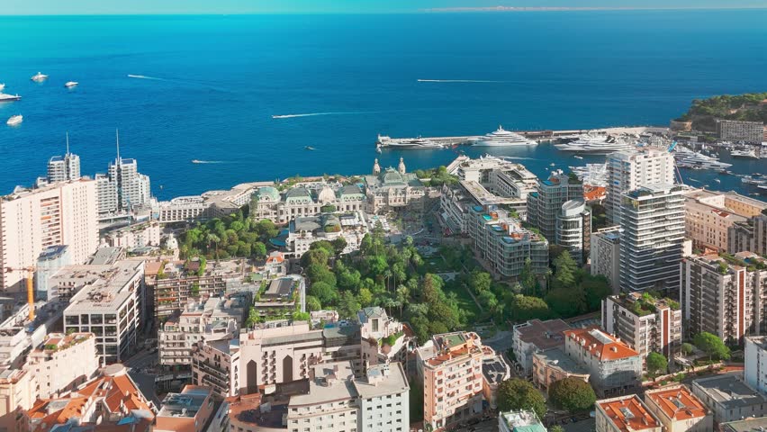 Aerial view of the Monte-Carlo casino in Monaco. Luxurious supercars in front of the hotel. City center of the Principality of Monaco. Famous casino and luxury buildings in Monte Carlo, Monaco