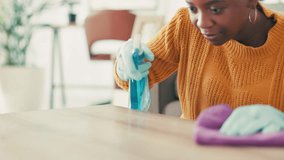 Black woman, spray and cleaning surface with cloth for hygiene, disinfection or housekeeping at home. Female person, African maid or cleaner with detergent or fabric wipe for bacteria or germ removal - Powered by Shutterstock - Get 15% off with code: PIKWIZARD15