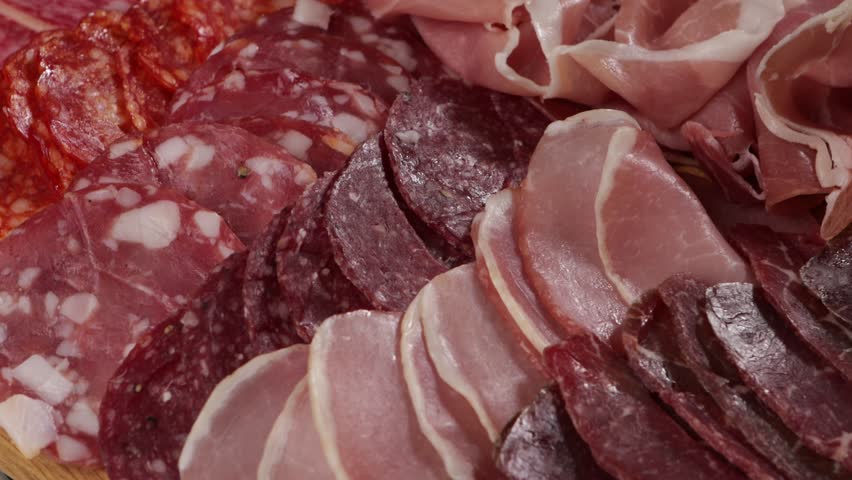 Sliced ham, salami cold meat close up background food