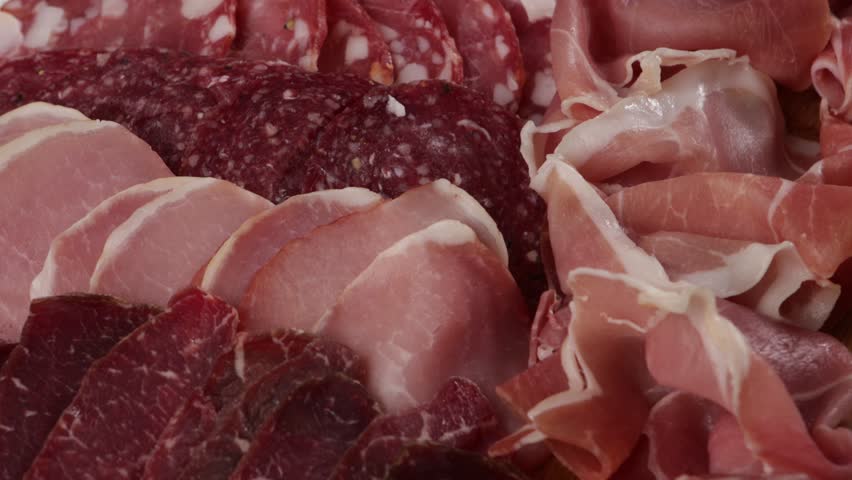 Sliced ham, salami cold meat close up background food
