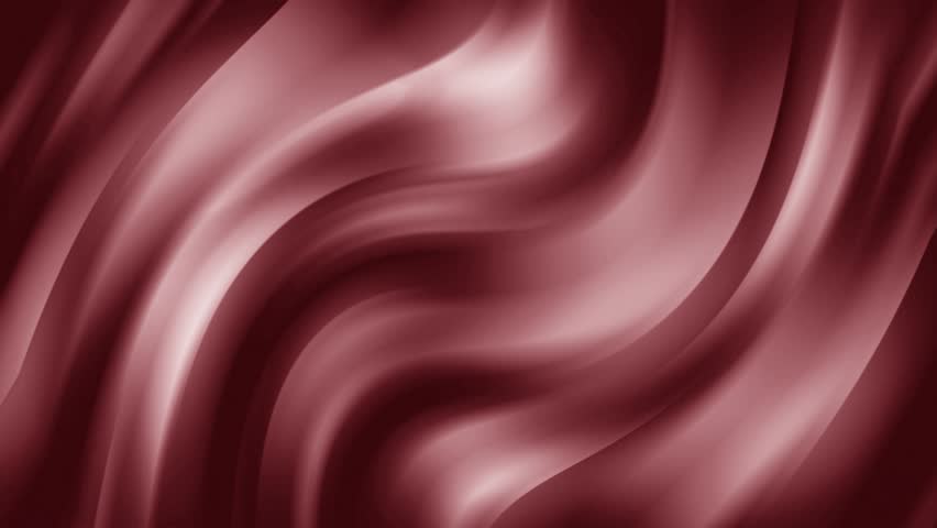Flowing red silk fabric creating elegant waves in the wind
