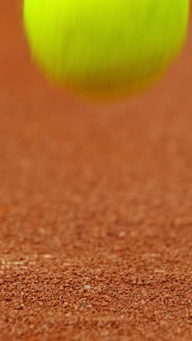 Super Slow Motion of Hitting Tennis Ball on Line. Low Depth of Focus. Filmed on High Speed Cinema Camera, 1000fps. Vertical Aspect Ratio.