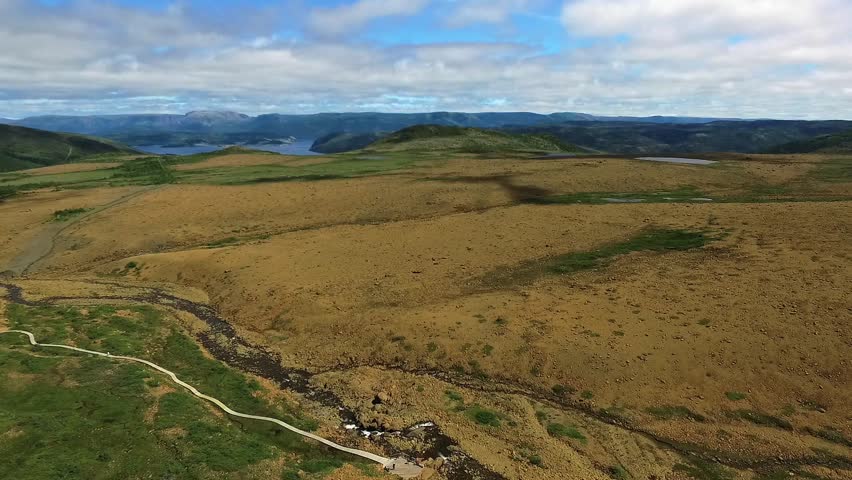 An aerial footage of the Tablelands trail near Gross Mourne National Park, in the Canadian province of Newfoundland and Labrador on a sunny day