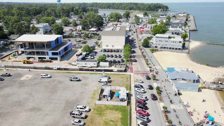 Atlantic coastline in Chesapeake Bay with piers, parking lots and hotels. Bird