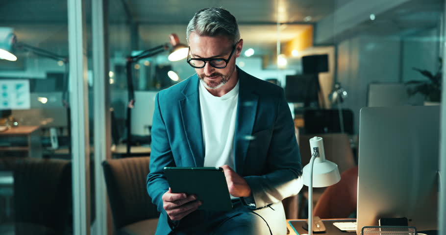 Digital, night and man with tablet, office and trader with info for stock market, research and online. Browsing, person and working late for GDP growth, employee and investor with app in business