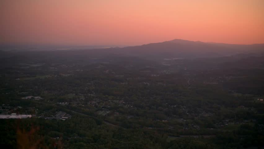 Vertical screen Dusk View of Buffalo Mountain Park, USA panoramic view of Buffalo Mountain Park dusk, showcasing soft, colorful sky lush greenery nature, tranquility, and landscape themes.