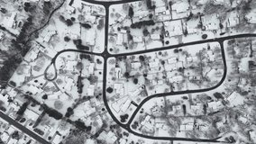 A drone view captures Kitchener, Ontario, blanketed in snow. The city's streets, rooftops, and parks are transformed into a peaceful winter landscape - Powered by Shutterstock - Get 15% off with code: PIKWIZARD15