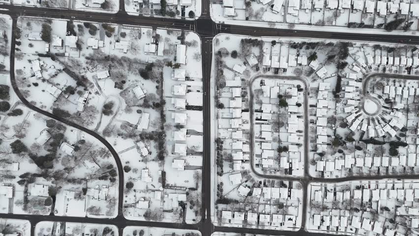 An aerial footage of the snow-covered Kitchener from above during the season of winter at the daytime in Ontario, Canada