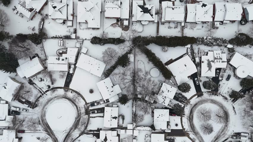 A drone footage of the snow covering all the city of Kitchener, Ontario at a daytime in Canada