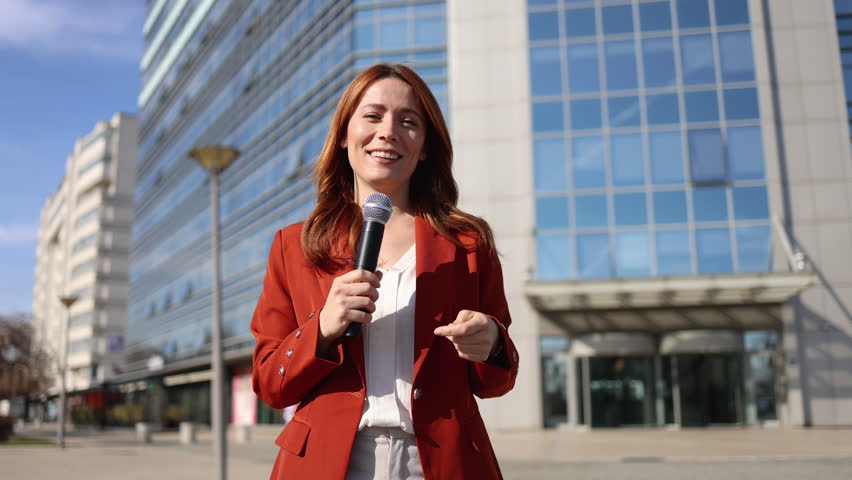 Beautiful journalist is reporting for the TV