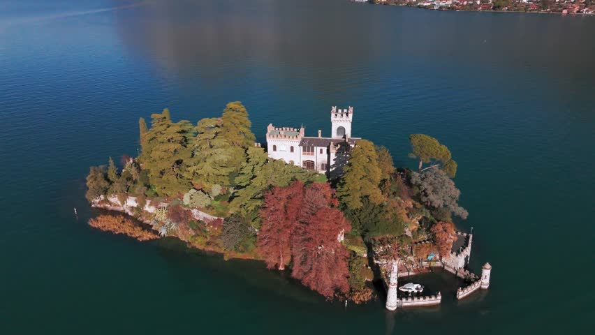 An Aerial view of Isola di Loreto, small island in Iseo Lake, Italy surrounded by mountains