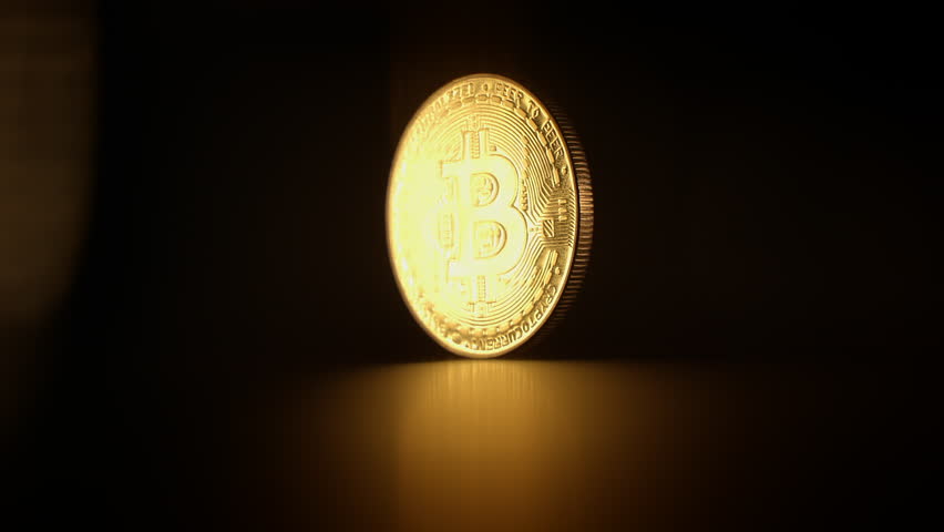A Glorious Golden Bitcoin Coin Set Against a Dark Background for a Striking Visual Impact