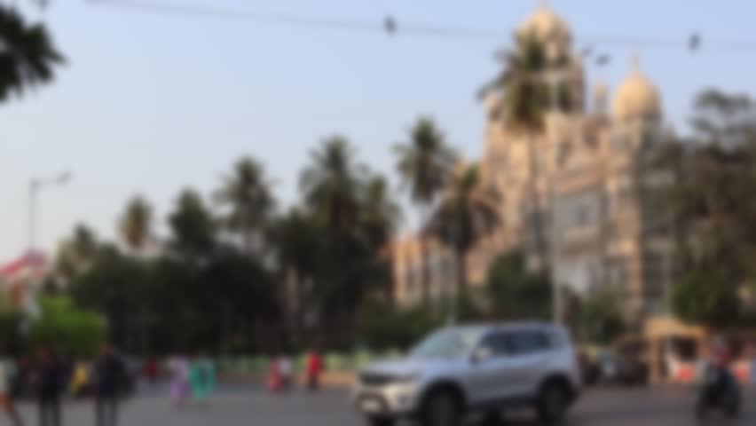 Blurred view of Maharshi Karve Road and Western Railway Head Office at the background in Mumbai, India. Busy evening road traffic in the old city.
