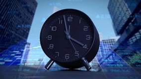 Modern black alarm clock set against an urban background showcasing digital data analytics - Powered by Shutterstock - Get 15% off with code: PIKWIZARD15