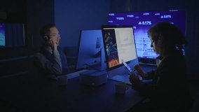 Business professionals engaged in analyzing data within a contemporary office environment - Powered by Shutterstock - Get 15% off with code: PIKWIZARD15