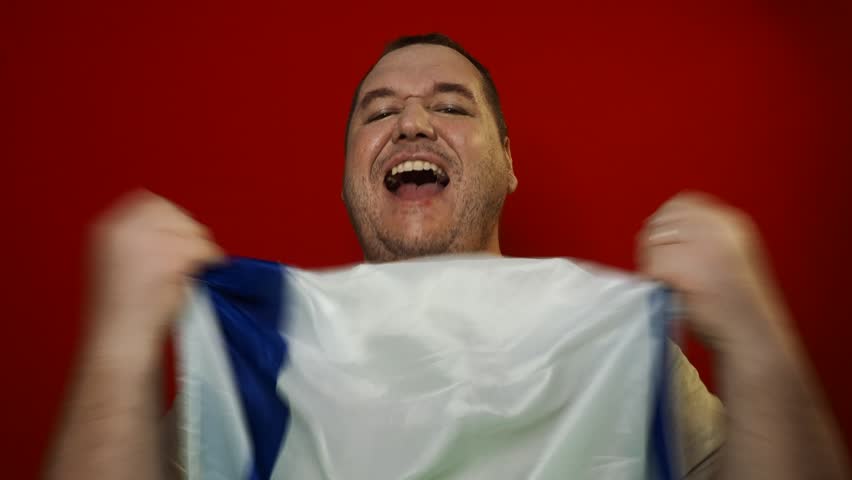 Pride and joy. A grown man waving an Israeli flag.