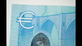 20 Euro Cash Stop Motion. Macro of banknote Euro. Euro money closeup. Concept Finance Business Investment Success. Financial success. Background Bill Sign Eu Money. Financial Crisis - Powered by Shutterstock - Get 15% off with code: PIKWIZARD15