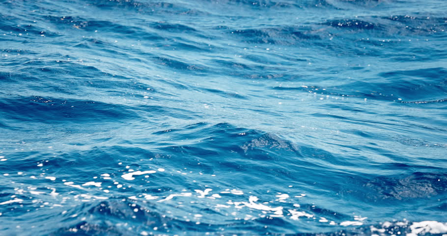 Blue Ocean Waves With Ripples and Sparkling Sunlight Reflections, Caribbean sea water Dominican Republic