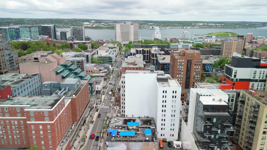An Aerial View Of Halifax, Nova Scotia, Featuring The Intriguing Mix Of Historic Streets And Modern Skyscrapers. The Footage Captures The Dynamic Urban Landscape That Defines The City.