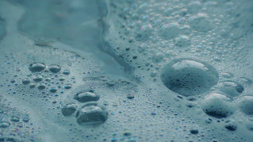 Detergent Bubbles On Water Surface