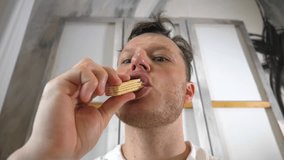 Dessert breakfast. A man eats waffles. In slow motion. A man eats sweet cookies - Powered by Shutterstock - Get 15% off with code: PIKWIZARD15